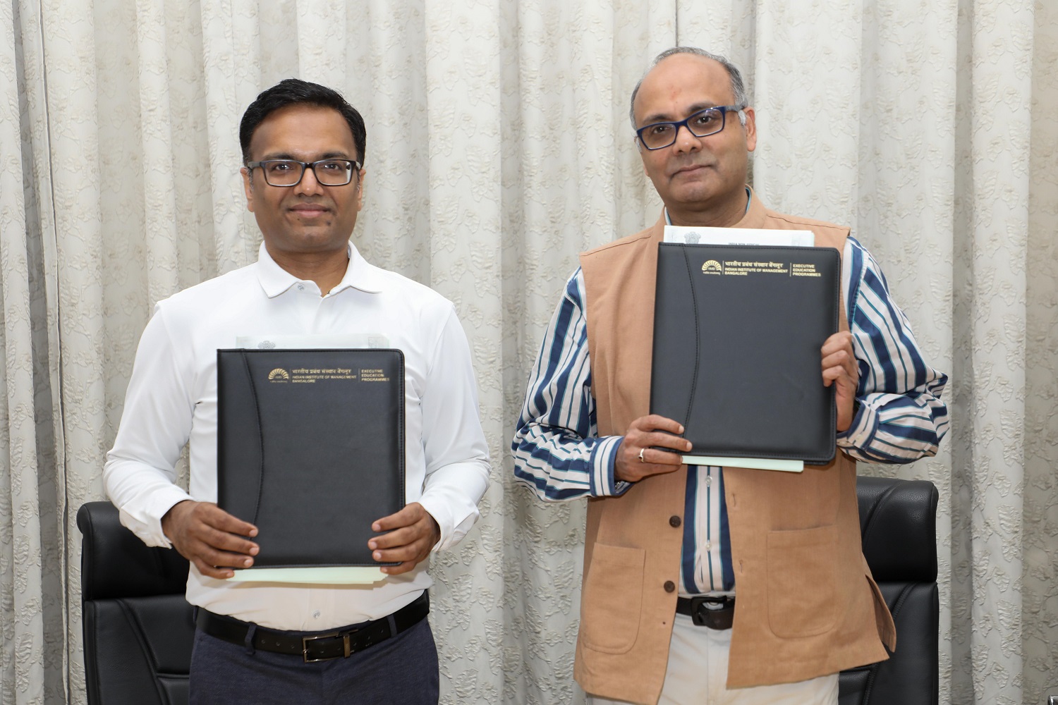 Mr. Uday Prakash, VP, Finance & Operations, Herbalife India, and Prof. Chetan Subramanian, Dean Faculty, IIMB, with the signed agreement.