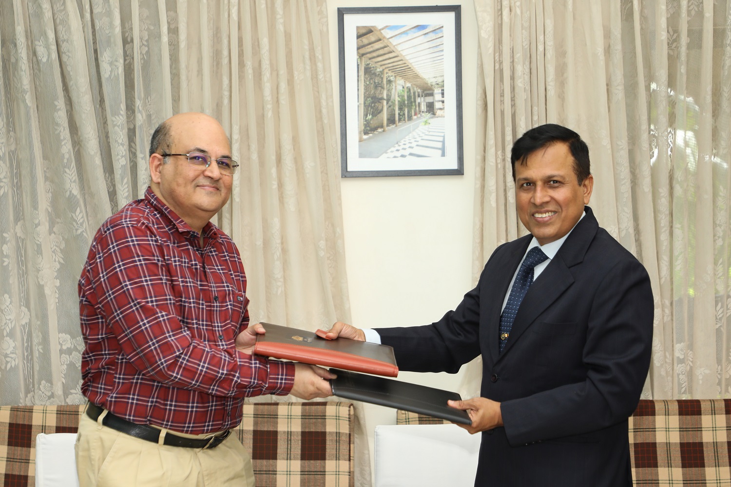 Prof. Rishikesha T Krishnan, Director, IIMB, and Sanjay Dwivedi, Director of Operations, Armoured Vehicles Nigam Limited, during the signing of an MoU between IIMB and AVNL.