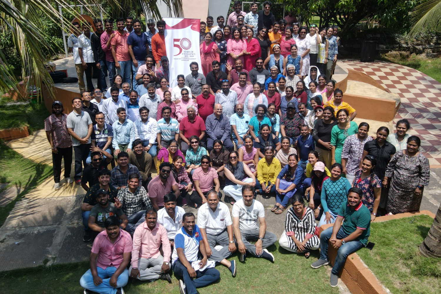 Group photo of IIMB staff with Prof. Rishikesha T Krishnan, Director, IIMB and Prof. Rajendra K Bandi, Dean, Administration, at the annual staff retreat organized on 19th May 2023.