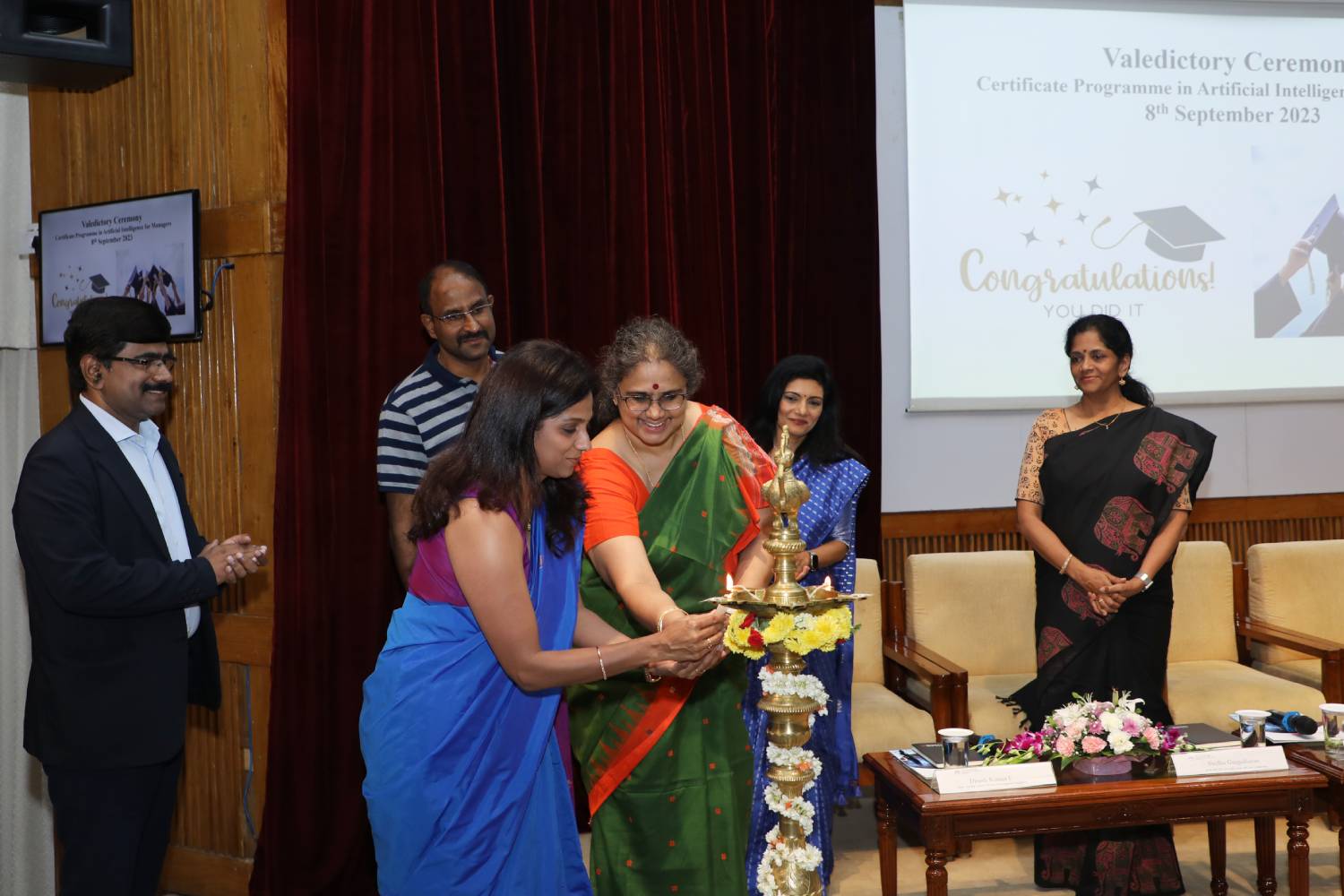 A participant of the progamme, ‘Artificial Intelligence for Managers’, and Prof. Vasanthi Srinivasan, Chairperson, Digital Learning and faculty in the OB&HRM area at IIMB, light the ceremonial lamp, at the valedictory ceremony of the programme, on 8th September 2023.