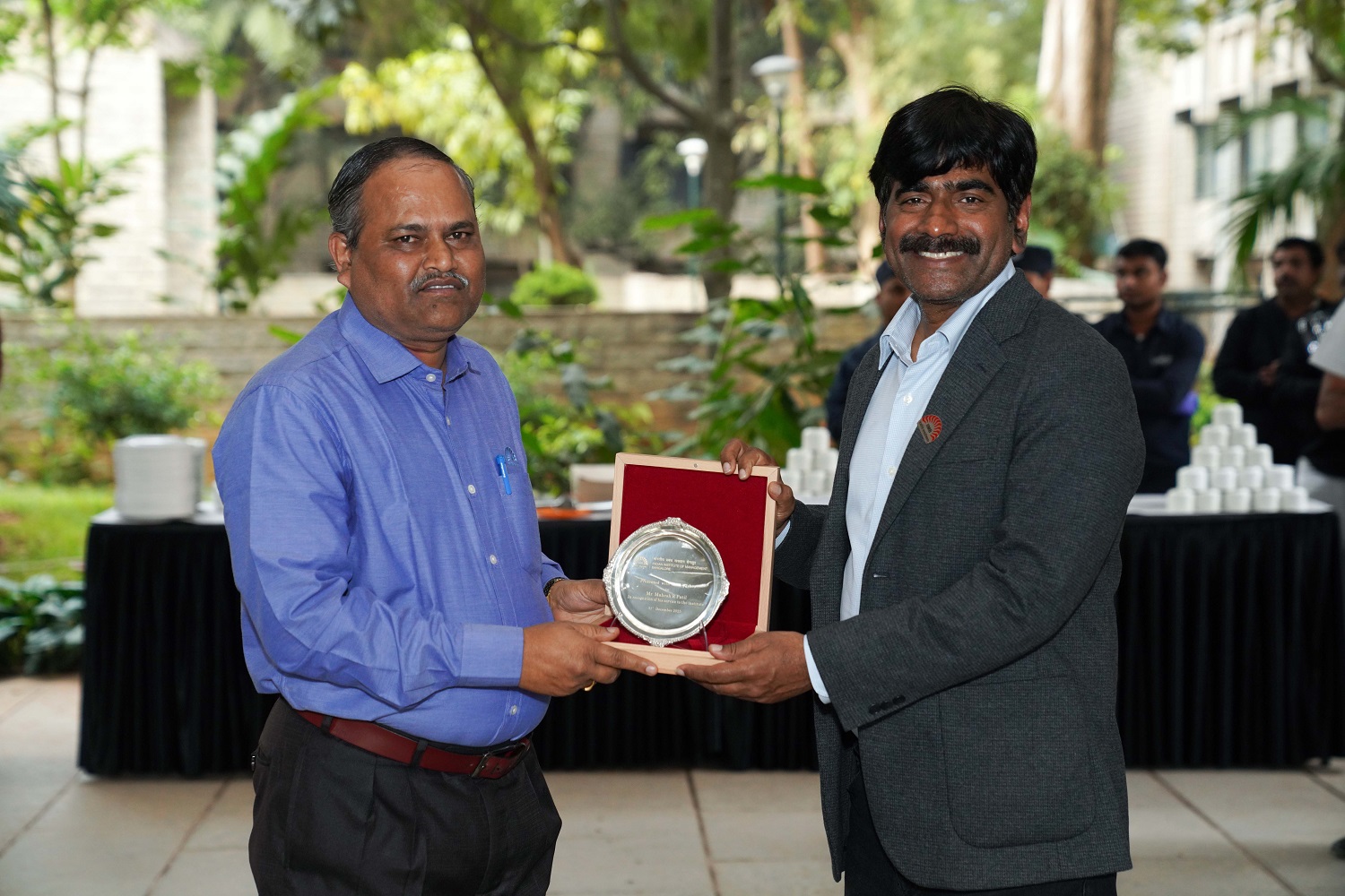 Prof. U Dinesh Kumar, Director In-charge, IIM Bangalore, felicitates Mahesh R Patil, Senior Manager – Horticulture & Housekeeping, Office of CAO, IIMB, during a farewell function. Mahesh Patil was relieved from the services of the Institute on 31st December 2025.